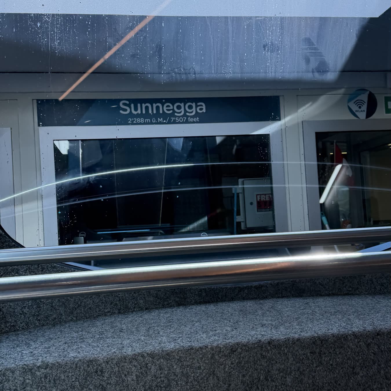 The Sunnegga station sign at 2,288 metres above the funicular doors