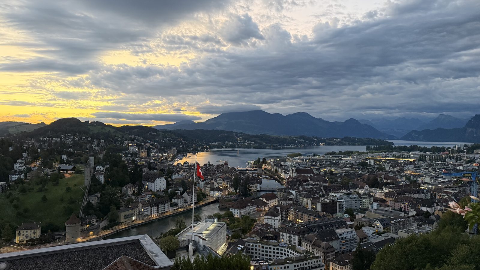 Lucerne before sunrise seen from the hill above the town, with the lake and mountains under heavy cloud